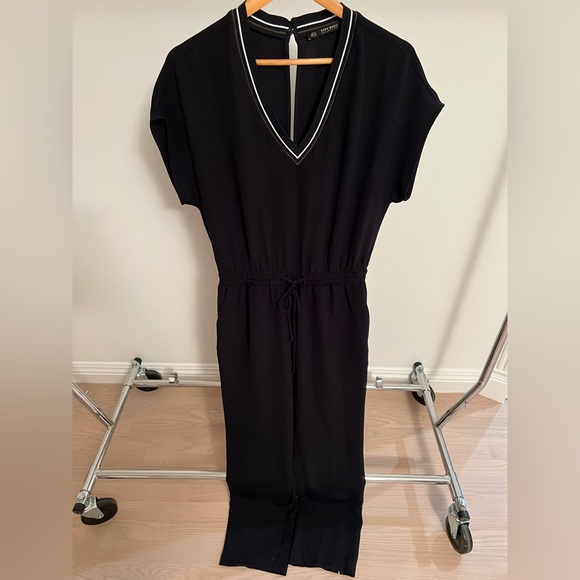 Zara Jumpsuit with pockets and drawstring waist. Side stripe/v-neck detailing. - Picture 1 of 5